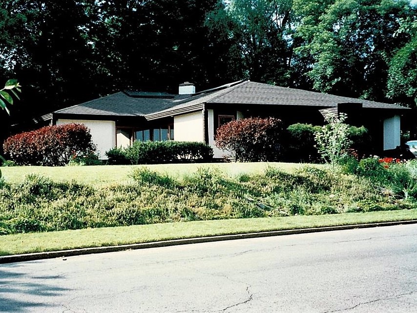 Quiet low house is set back leaving a bigger front yard