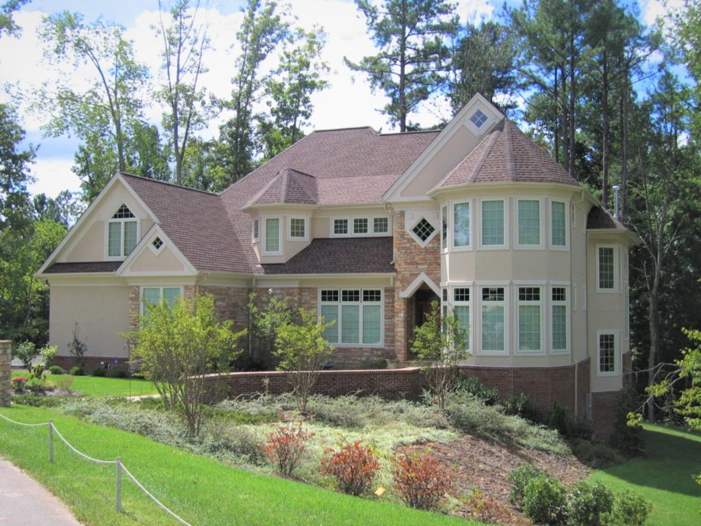 Some small detailing this stucco and stone home design